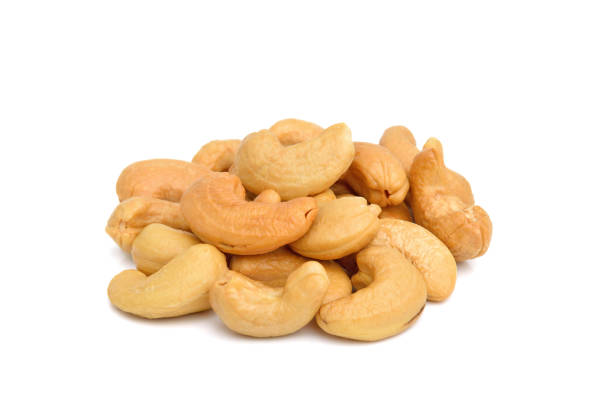 istock Cashew nuts heap isolated on white 1237425503