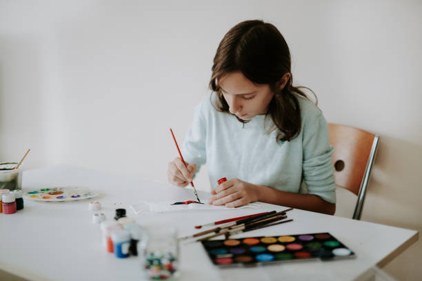 istock young girl who designed the mask 1237488908
