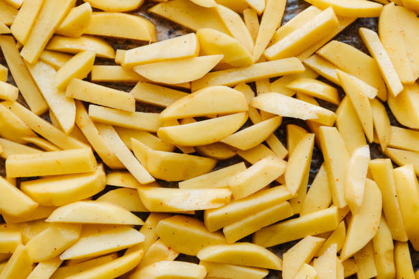 istock Sliced potatoes are laid out on a baking sheet and ready to be baked 1237494730