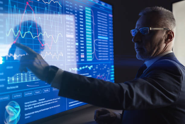 istock The man working on the big digital screen in the dark room 1237516148