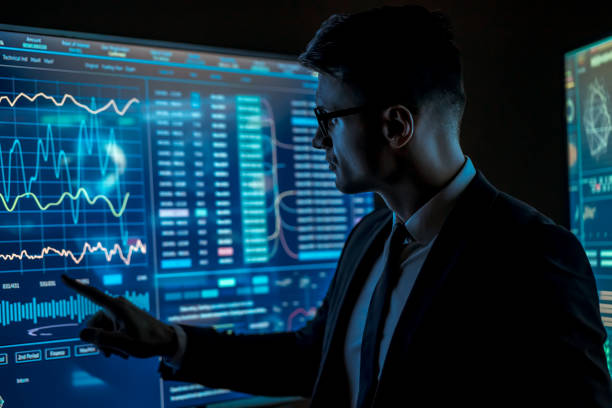 istock The man taps a blue sensor monitors in the dark lab 1237520278