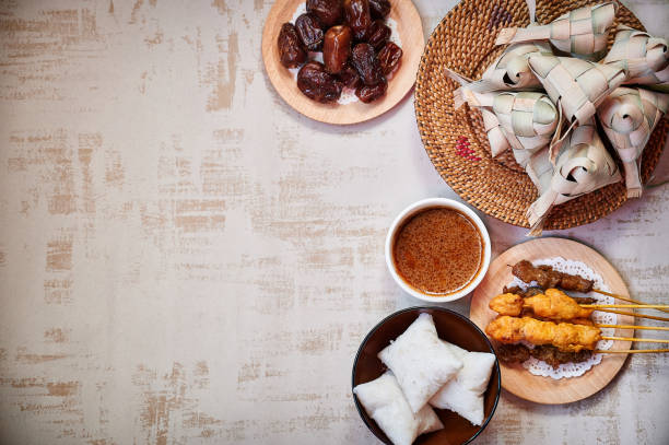 Hari Raya food, Ketupat or Malay rice dumpling, satay and dates Hari Raya Aidilfitri Traditional Cuisine food traditional malaysian food stock pictures, royalty-free photos & images