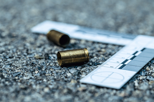 Crime scene with close up of bullet casings