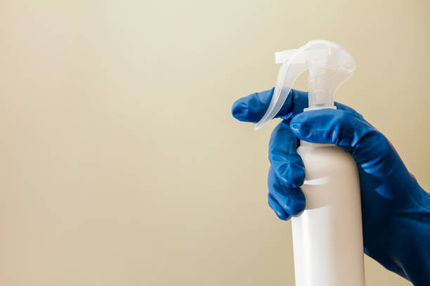 istock A human hand in a protective glove holds spray disinfectant for viruses prevention 1237574395