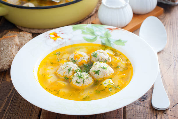 istock Potato soup with meatballs on a wooden table, horizontal 1237579673