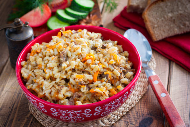 istock Barley porridge with stewed beef in a ceramic bowl, selective focus 1237583421