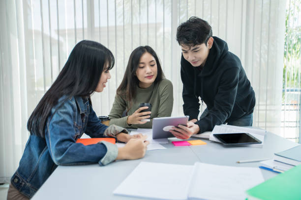 istock Asian students read books and use digital tablets to find information for work and online studies 1237592477