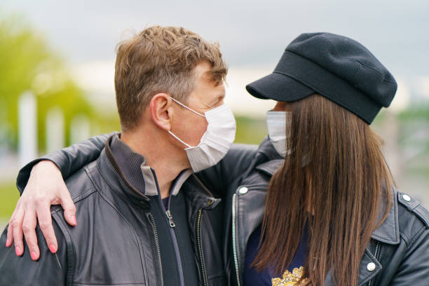 istock Heterosexual pair walking in the city park 1237605670