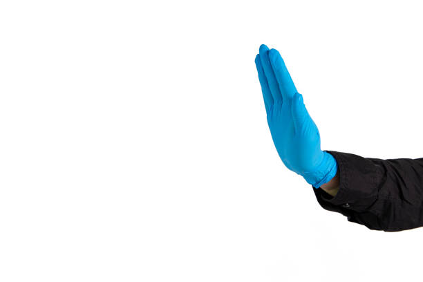 keep distance sign by hand in latex glove medicine tool on simple background isolated white space for copy or your text here, global pandemic concept poster advertising format