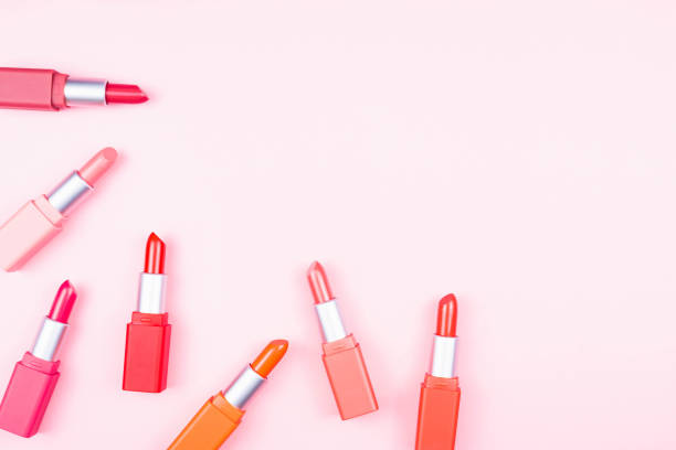 istock Set of beautiful lipsticks arrange on pink background with copy space 1237618952