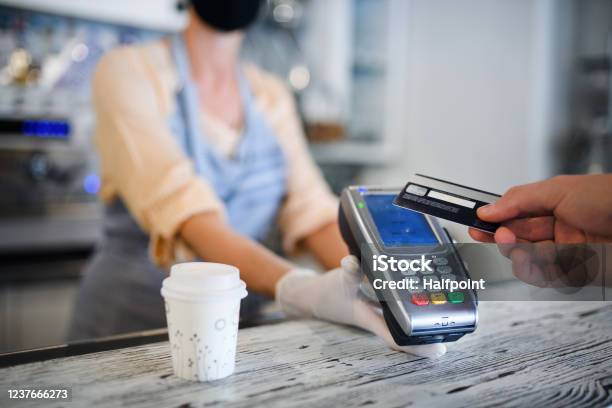 Contactless Payment With Debit Card Coffee Shop Open After Lockdown Stock Photo - Download Image Now