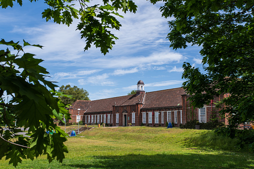 Belfast, Northern Ireland, UK - May 30, 2020: View from public road of the entrance of Strandtown Primary School.  Designed by RS Wilshere, it was completed in 1930 with a neo-Georgian facade.  The school caters for Years 4 to 7.