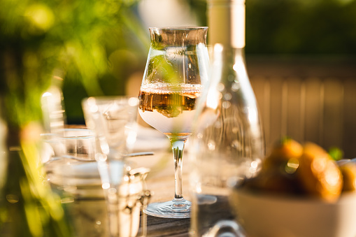 A glass of cold rose wine at a Swedish midsummer dinner party.