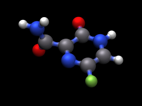 A molecular model of the antiviral drug favipiravir. Used as a treatment for influenza and being examined as a treatment for COVID-19.\nIsolated on black.