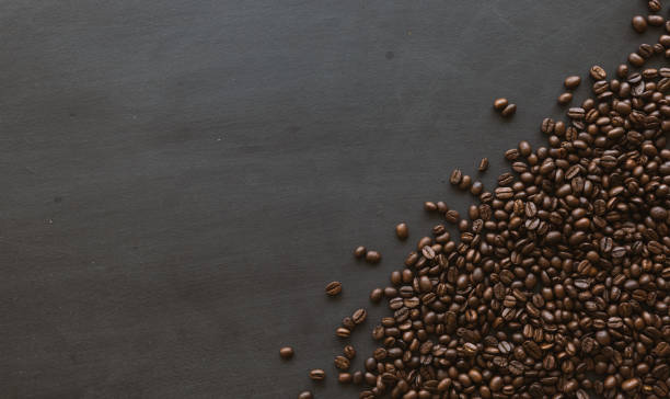 istock coffee bean on black wooden floor background. top view. space for text 1237700762