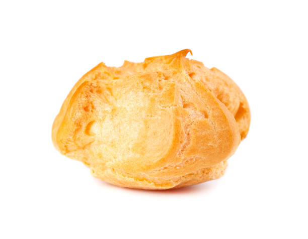 istock Homemade profiteroles with cream,isolated on a white background. Fresh baked golden profiterole. Custard cake. 1237702949