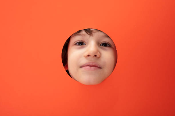 Cute little child peeking at playground