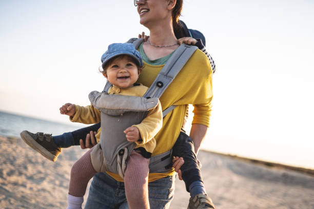 istock Mother walking on the beach with her kids 1237721216