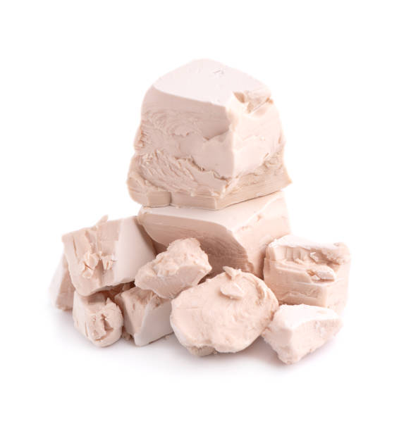 istock Fresh pressed yeast, isolated on white background. Compressed fresh yeast block. 1237725484