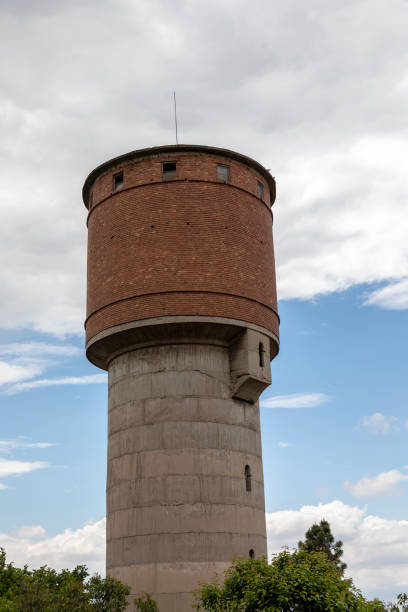 istock Abandoned brick and concrete water tower. 1237740770