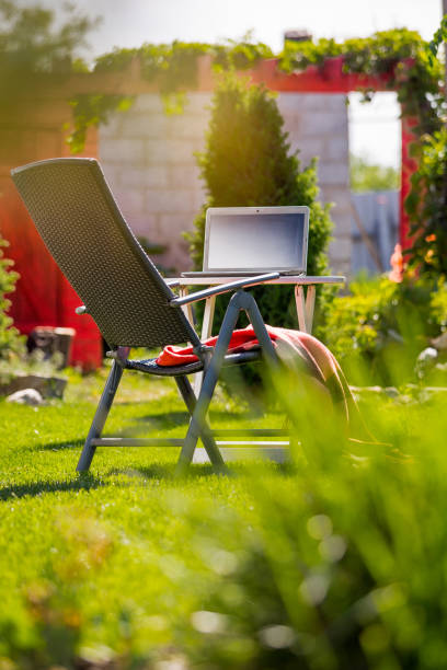 istock Working, studing in one's own garden with online lessons, staying home 1237757446