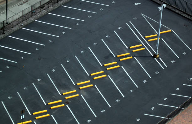 Abstract shots of parking lot with white and yellow stripes, arrows, crosswalks, signs, and symbols Abstract shots of parking lot with white and yellow stripes, arrows, crosswalks, signs, and symbols. no parking sign photos stock pictures, royalty-free photos & images