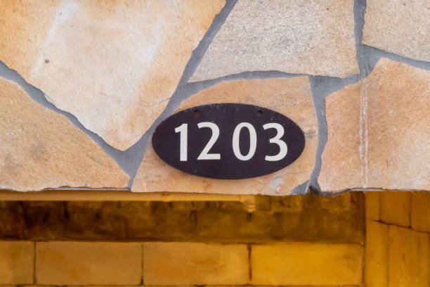 istock Oval house number plate with the number 1203 1237778214