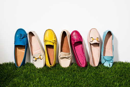 Fashionable women’s  shoes isolated on grass background(with clipping path)