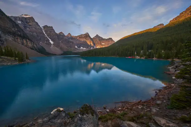 Photo of Perfect reflection with shoreline at Moraine Lake in Canada