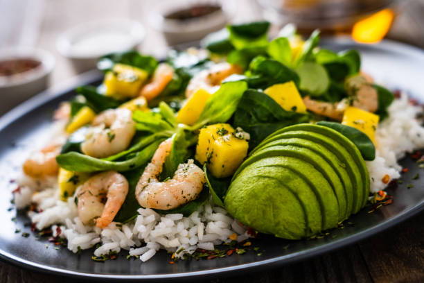 istock Prawns with vegetables on wooden table 1237826879