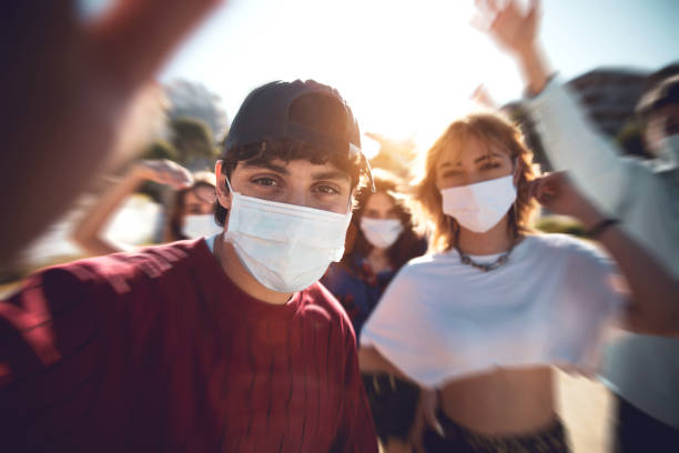 istock Generation Z teens wearing protective face masks 1237830342