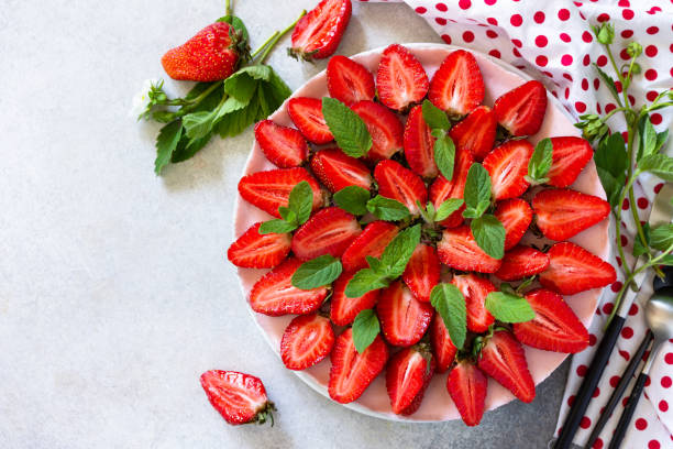 istock Summer diet dessert, cheesecake without baking. Strawberry cheesecake on a chocolate granola with fresh strawberries on a light gray table top. Top view flat lay background. 1237840079