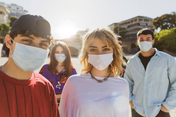 istock Generation Z teens wearing protective face masks 1237844839