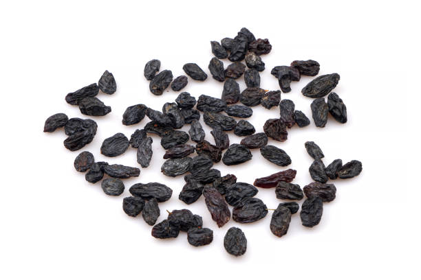 istock Organic Dark raisins isoalted on white background 1237844846