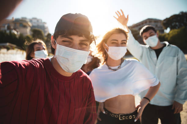 istock Generation Z teens wearing protective face masks 1237845365