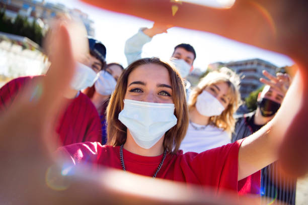 istock Generation Z teens wearing protective face masks 1237846993