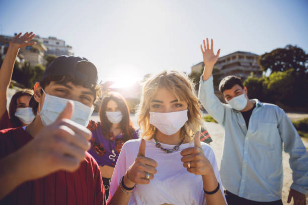 istock Generation Z teens wearing protective face masks 1237848229