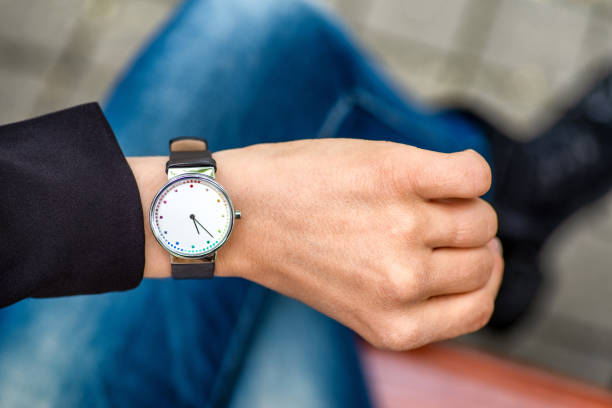 istock What time is it. Silver wristwatch on hand of woman. 1237852695