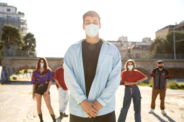 istock Teenage boy posing wearing protective face mask 1237854780