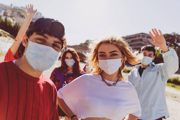istock Generation Z teens wearing protective face masks 1237856376