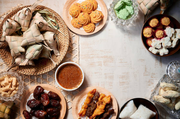 istock Hari Raya food, Ketupat or Malay rice dumpling, satay, cookies and dates 1237869468