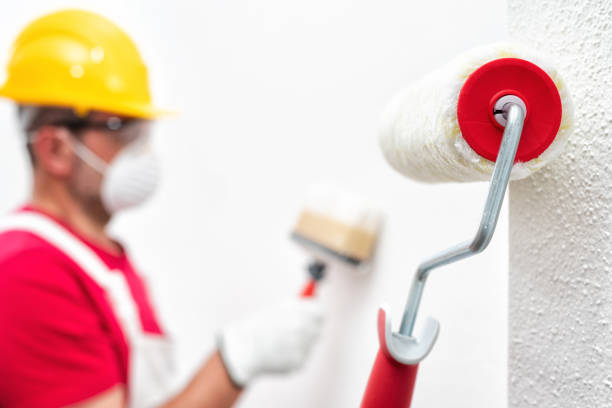 istock House painter, roller for painting. Building. 1237870220