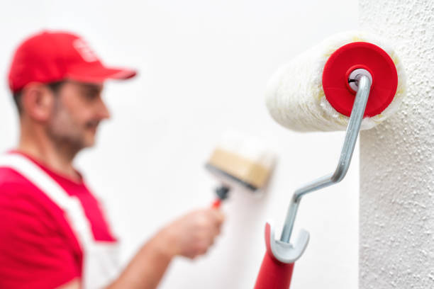 istock House painter, roller for painting. Building. 1237870235