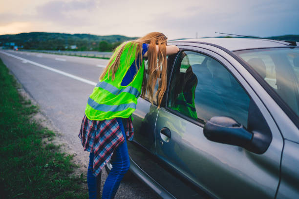 istock Worried woman with damaged car 1237894684