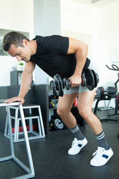 istock fit man working out at the gym 1237900989