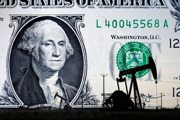 istock Oil rig and US banknote 1237919425