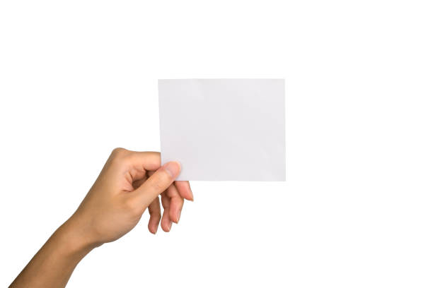 istock Hand isolated: Woman hand holding white paper with copy space on white background and clipping path 1237942074