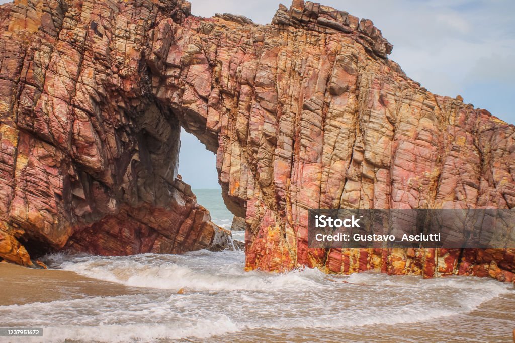 Rock Monument - Pedra Furada - Jericoacoara - Ceará - Brazil Pedra Furada - Ceará - Brazil Bay of Water Stock Photo