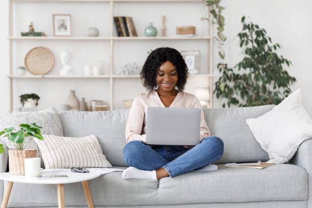 istock Remote Work. Millennial african american woman working on laptop at home 1237954919