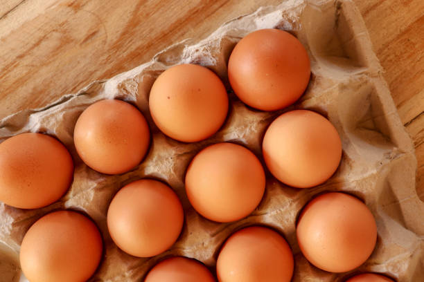 istock Thirty brown chicken eggs in a cardboard tray packaging. Raw fre 1237964473
